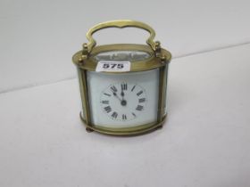 A French oval shaped brass cased carriage clock - oval shaped - approx 8cm x 10cm - working in