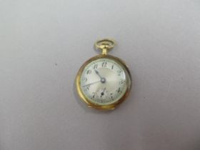 A small 18ct yellow gold double cased fob watch - case approx 2.7cm - seen working - weight approx