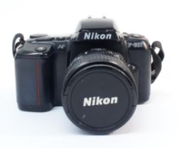 A Nikon F601 & Lens - Untested.