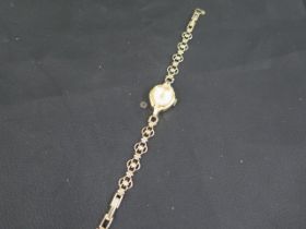 A ladies dress watch with a 9ct gold bracelet - approx total weight 14.06 grams