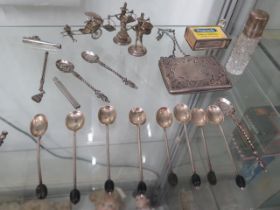 Assorted silver items to include: A set of eight Edwardian coffee bean spoons, an Edwardian match