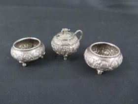 A pair of Indian silver (tested) salts and a mustard pot - salts approx 5.5cm diameter - with