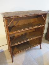 A Bamboo and rattan wicker small bookcase - good overall condition - approx 107cm x 92cm x 36cm