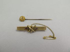 A 14ct yellow gold (un hallmarked but tested) brooch with rubies approx 4cm - weight approx 3.8