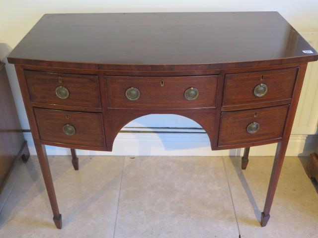 A Georgian mahogany and inlaid bow fronted Sheraton sideboard - in good condition with a good colour