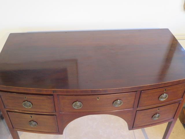 A Georgian mahogany and inlaid bow fronted Sheraton sideboard - in good condition with a good colour - Image 2 of 4