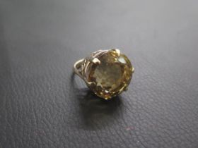 A large 9ct (tested) yellow gold and quartz ring - round quartz approx 2cm diameter - ring size L/