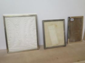 Two silver mounted photograph frames, Birmingham and London 1915 and a silver example, stamped