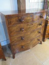 A 19th century flame mahogany bow fronted chest with two short over three long drawers - Width 100cm