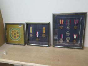 A set of framed 1st World War and Second World War medals and a framed set of 1999 uncirculated