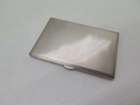 A silver cigarette case Birmingham 1965, machined rectangular case approx 12.5cm x 8.5cm - weight