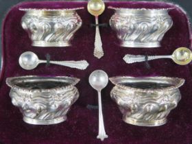 A late Victorian boxed set of four silver salts hallmarked Birmingham 1900 with an Art Nouveau