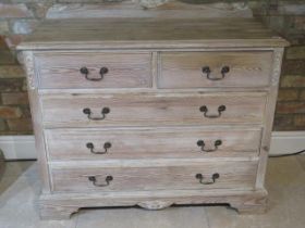 A pine chest with two short over three long drawers - Width 105cm x Height 83cm - in good condition