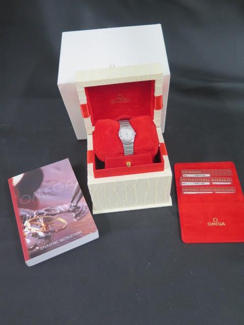 An Omega ladies Constellation wristwatch with diamonds set around the bezel - with box and papers