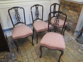 A set of four mahogany salon chairs