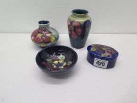 Four pieces of Moorcroft - two vases approx 10cm and 7cm, a bowl approx 9cm diameter and a box and