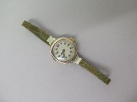 A 1920's ladies 9ct gold cased wristwatch - 26cm - working in saleroom
