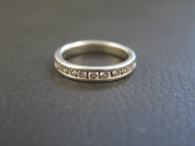 A platinum and diamond half eternity ring size L/M - weight approx 6.6 grams - with retailers