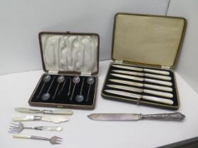 A boxed set of six silver coffee bean spoons with sugar tongs, Birmingham 1923 with a boxed set of