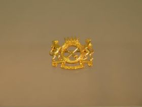 A 22ct yellow gold Royal Malay Regt pin badge marked 22K - in very good condition, including pin -