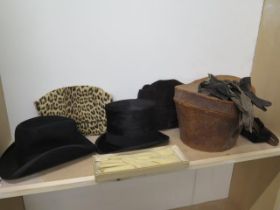 A top hat, 'A Gaird & Sons, Dundee' in leather hat box with another hat and three pairs of gloves