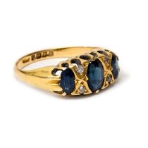 An 18ct yellow gold sapphire and diamond ring size L - weight approx 3.4 grams