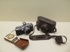 A 1949 Leica 111c 35mm camera number 472783 with leather case Summitar f=5cm 1:2 lens no 682503, 5cm