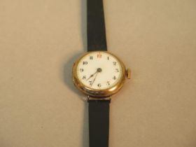 A 15ct yellow gold (hallmarked) cased ladies Trench watch - round case approx 23mm with leather