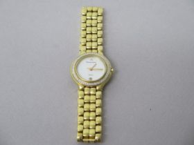 A ladies Maurice Lacroh quartz gold plated bracelet watch - round case 25mm with mother of pearl