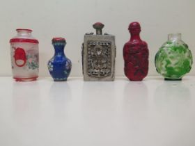 Five Chinese scent bottles - two glass, one cloisonne enamel, one white metal and one carved