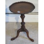 A small carved wine table - Diameter 33cm x Height 52cm