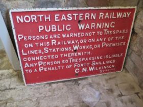 A large 'North Eastern Railway Public Warning' red cast iron sign
