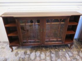 A mahogany bookcase with two glazed doors - Width 152cm x Depth 30cm x Height 87cm