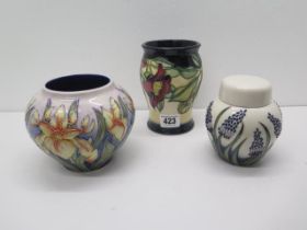 Three pieces of Moorcroft - Jar and cover approx 11cm and two vases 11cm and 14cm Condition - very