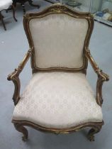 A good quality gilt armchair with out swept arms, a serpentine front and cabriole legs - in nice