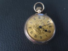 A 9ct gold keyless open face fob watch the 25mm dial with Roman numerals - approx weight 16.85 grams