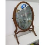 An Edwardian oval dressing mirror