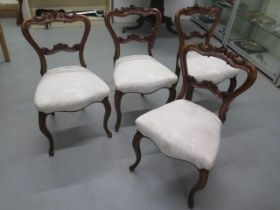 A set of four mahogany dining chairs on cabriole legs - in good condition, nicely upholstered in a