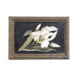A VICTORIAN PIETRE DURA PANEL MID-19TH CENTURY depicting a white lily with green leaves on a black