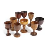 NINE TREEN GOBLETS LATE 18TH CENTURY AND LATER including a George III fruitwood example, a pair with