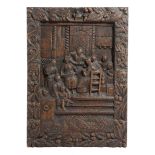 AN ENGLISH OAK PANEL 18TH CENTURY carved with an interior scene of a lady having her hair combed