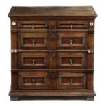 A CHARLES II OAK AND CEDAR CHEST C.1680 with four long drawers, with panelled fronts and applied