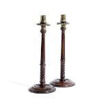 A PAIR OF TURNED MAHOGANY CANDLESTICKS IN GEORGE III STYLE, LATE 19TH CENTURY each with a brass