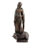 A SOUTH GERMAN WALNUT FIGURE OF ST MARGARET OF ANTIOCH 17TH CENTURY carved with her hands clasped in