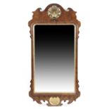 A GEORGE II WALNUT FRET-FRAME WALL MIRROR C.1730-40 the later arched plate within a carved