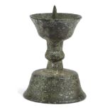 A MINIATURE BRONZE PRICKET CANDLESTICK 15TH / 16TH CENTURY the goblet shaped drip-pan with a central