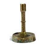 A RARE ENGLISH COPPER ALLOY OR LATTEN CANDLESTICK 15TH CENTURY the socket above a stem with a