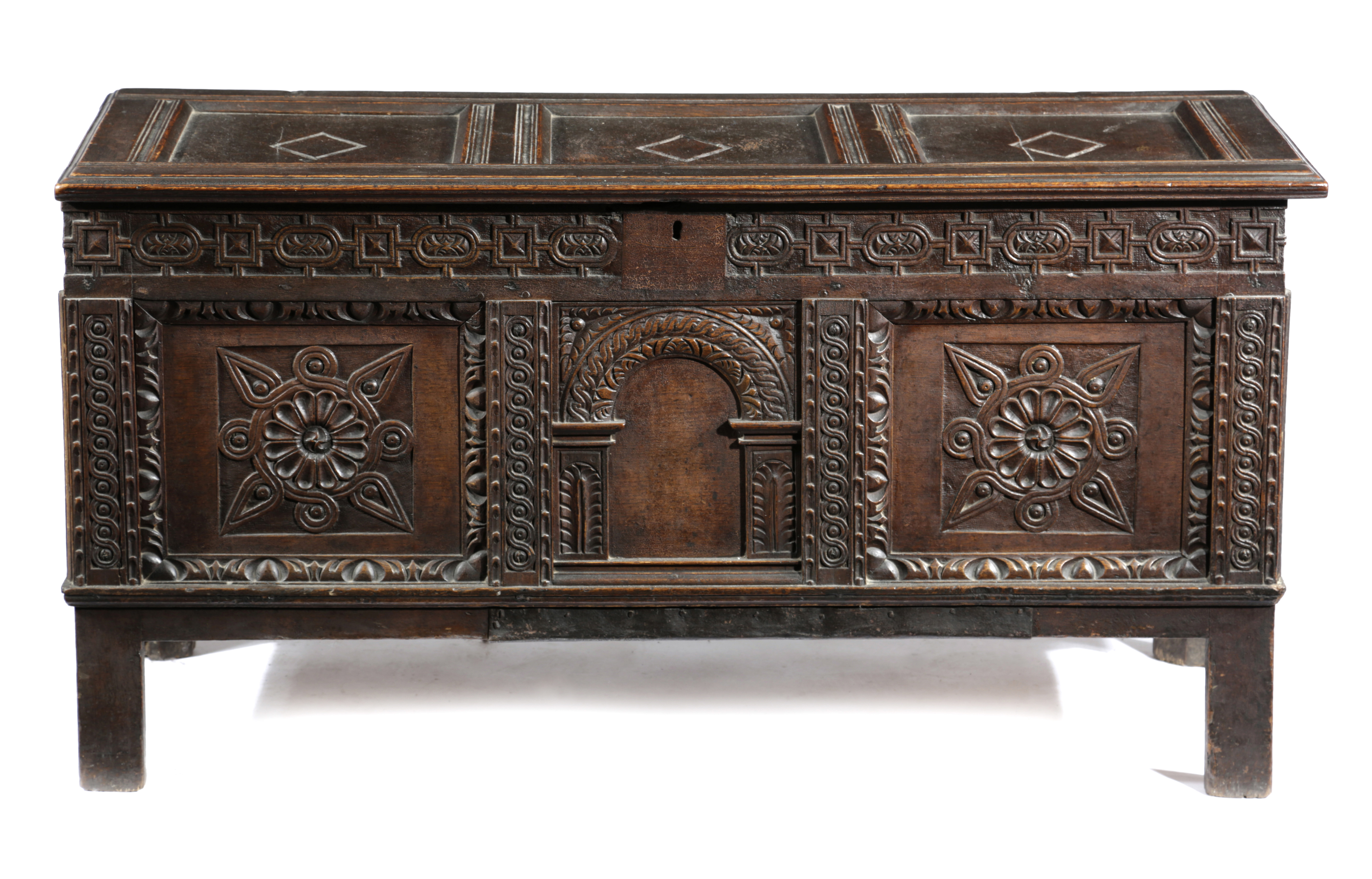 AN OAK COFFER 17TH CENTURY AND LATER with a triple panelled lid above a strapwork frieze, with a