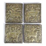 A SET OF FOUR PERSIAN EMBOSSED BRASS PLAQUES POSSIBLY TEHRAN, LATE 19TH CENTURY depicting various