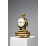 *A FRENCH WHITE MARBLE AND ORMOLU MANTEL CLOCK BY CHARLES BERTRAND, PARIS, LATE 18TH CENTURY the